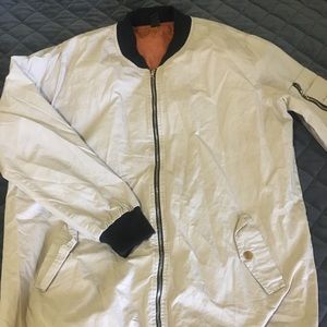 Light khaki and black bomber jacket